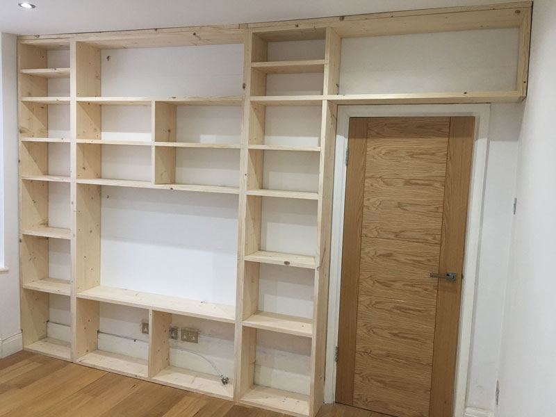 Cupboards being fitted under the shelves