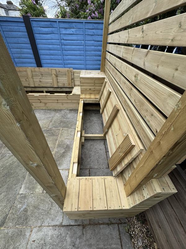 Looking down into the storage under the bench seats with the lids lifted