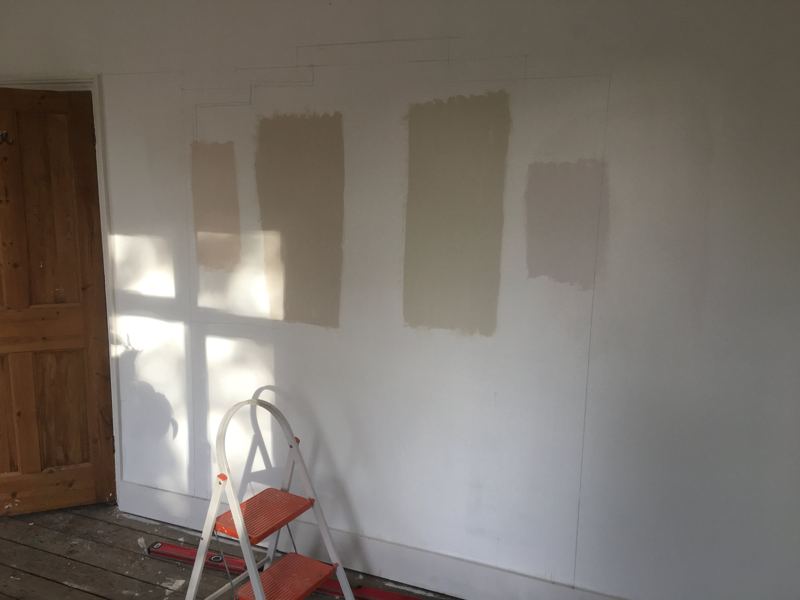 The wall before, with paint samples on it