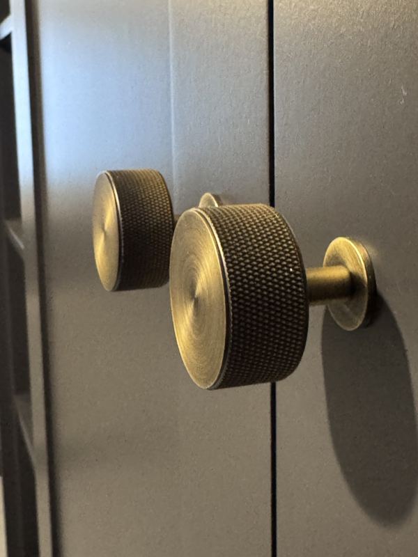Close up of the knurled brass wardrobe knobs