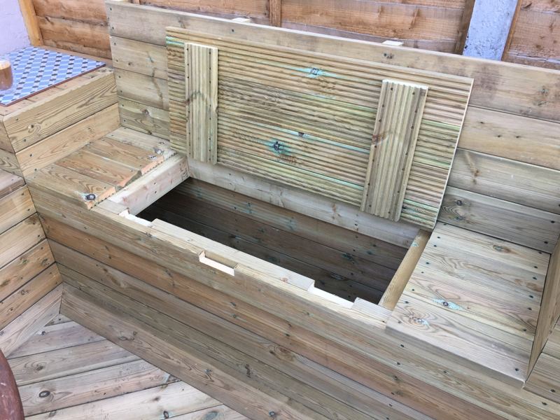 The built-in storage box with the lid open