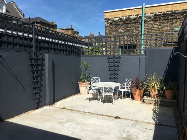 New trellis on freshly painted garden wall