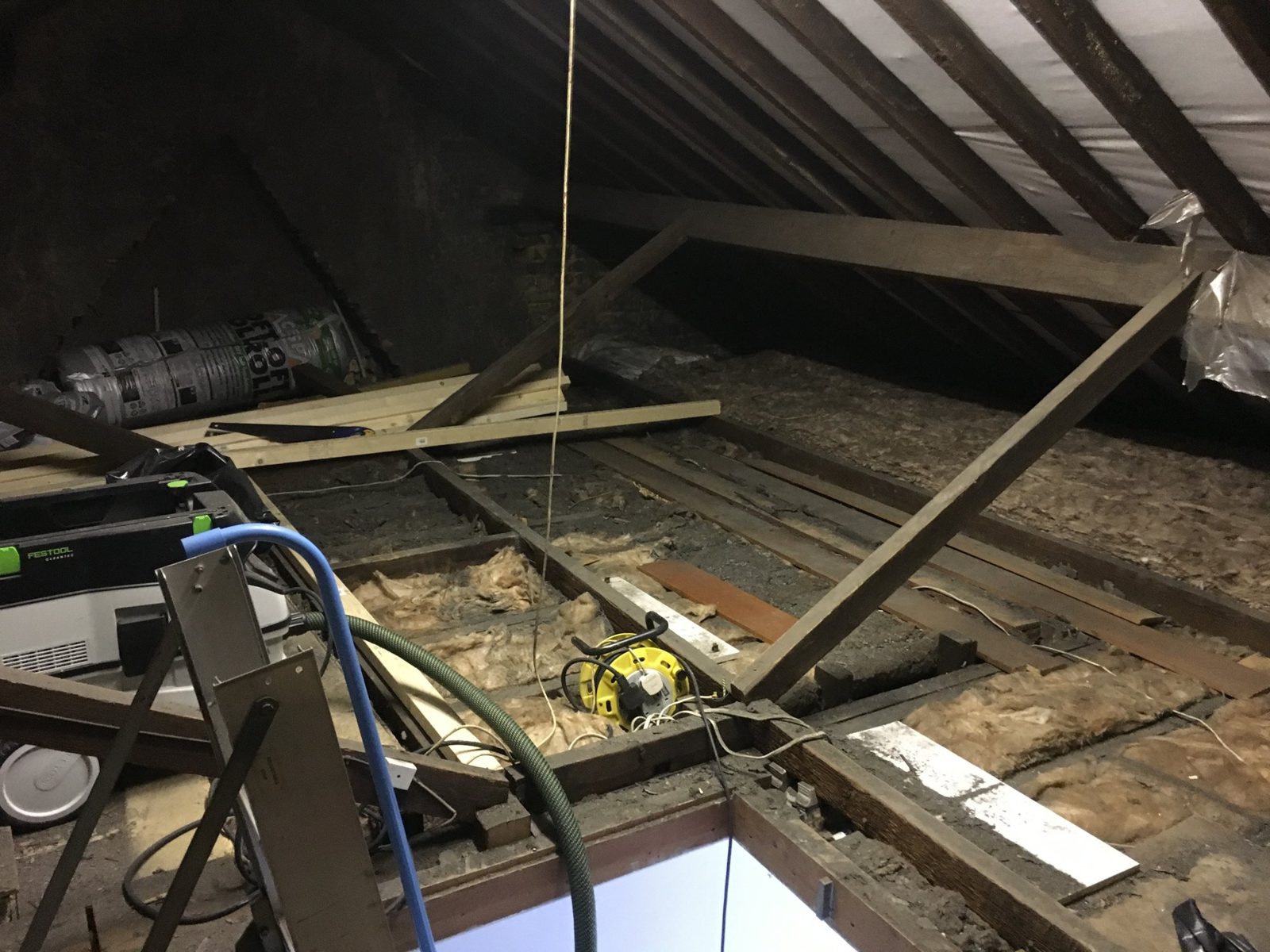 Boarded storage platform in a loft with insulation around it