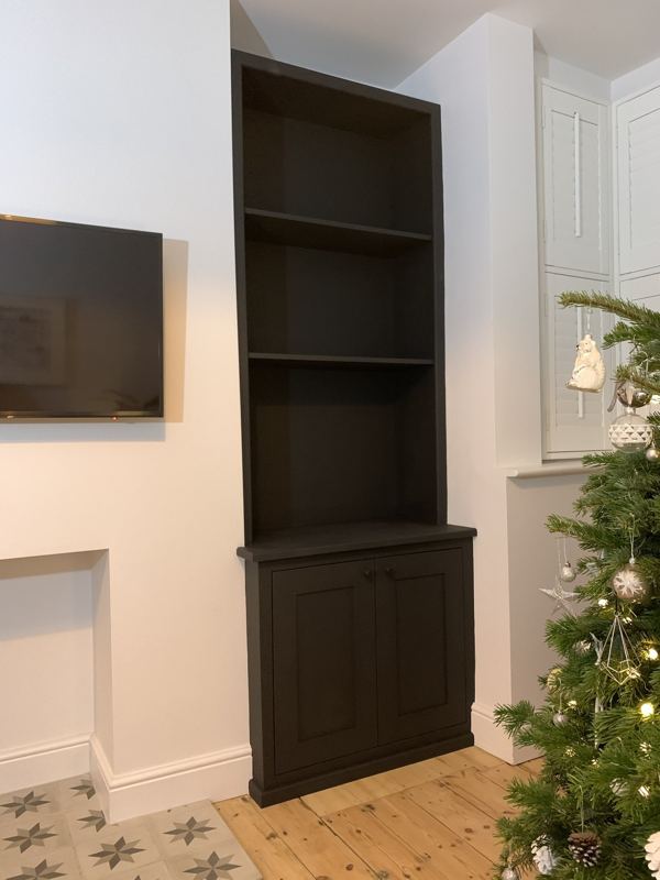 The second alcove unit next to the window, cupboard below and shelves above
