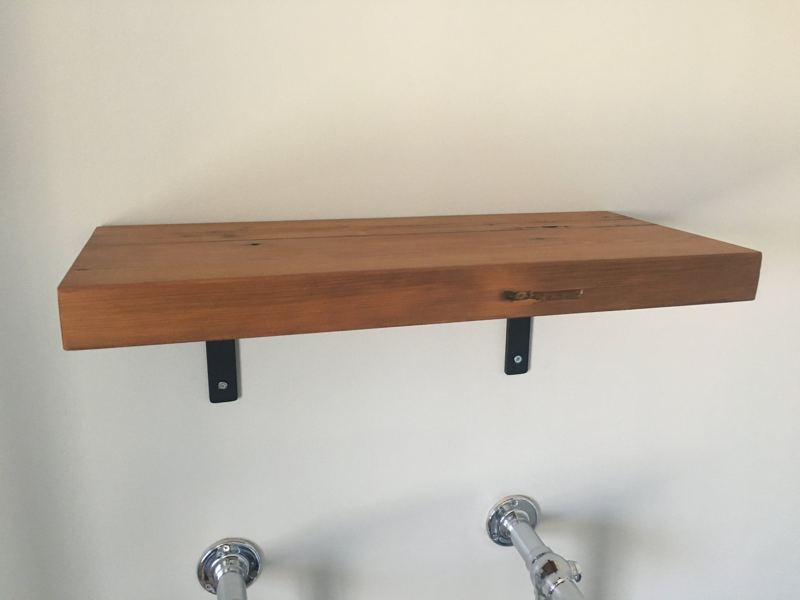 The shelf above a traditional towel radiator