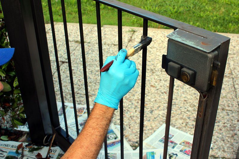 Painting a garden gate in Walthamstow